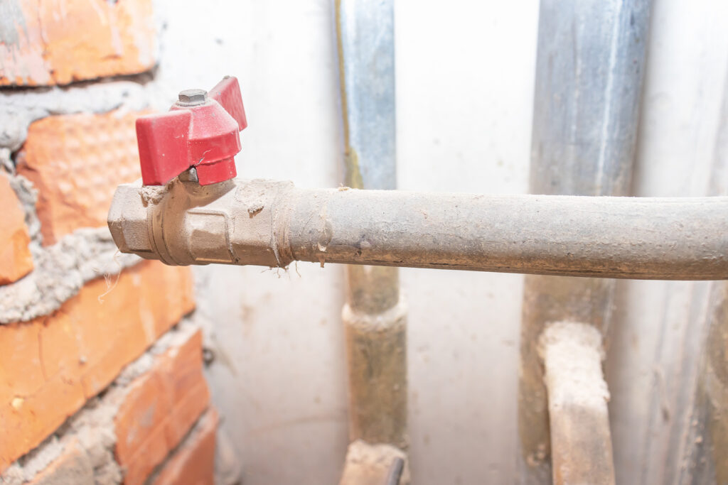 Red Water Valve On Old Metal Pipe Line